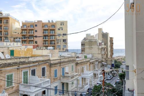 a view of a city street with buildings at Modern Paceville Suites with WIFI & AC by 360 Estates in Paceville