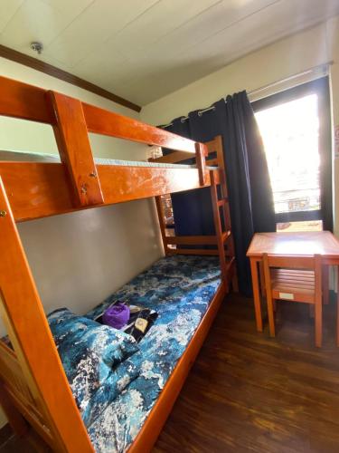 Postel nebo postele na pokoji v ubytování TLCS - Hearth&Home Baguio City