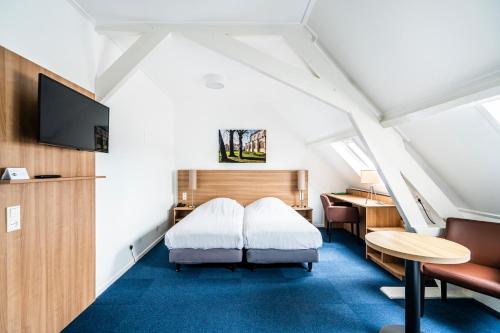 Postel nebo postele na pokoji v ubytování Hotel Hulst