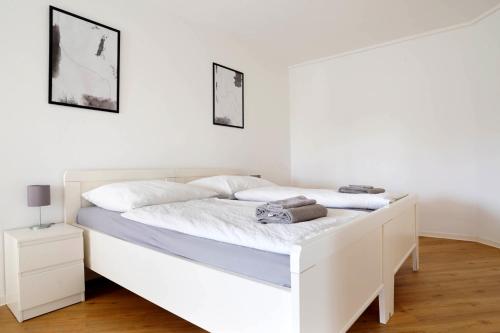 Ένα ή περισσότερα κρεβάτια σε δωμάτιο στο Schöne Apartments in Bad Rothenfelde I private Parkplätze mit Ladesäulen I home2share