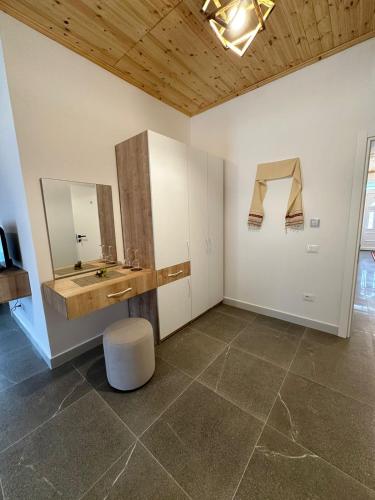 a bathroom with a sink and a mirror at Qyteza Guest House & Camping in Renc