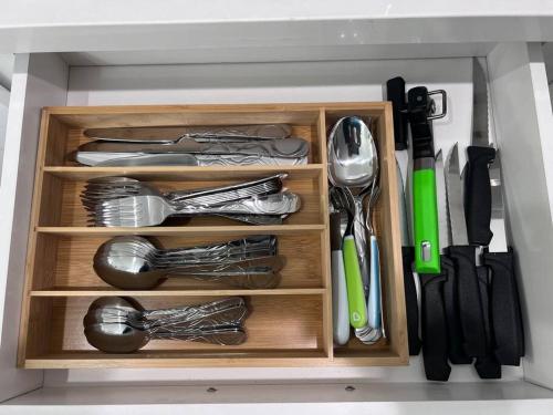 a drawer filled with utensils in a kitchen at NEW! 2-Bedroom Fontana Guest House close to Kaiser Permanente in Fontana