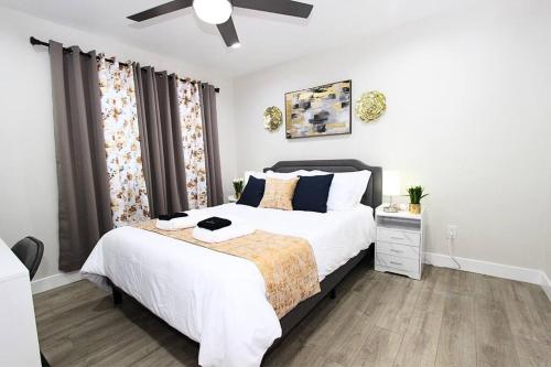 a bedroom with a bed and a ceiling fan at NEW! 2-Bedroom Fontana Guest House close to Kaiser Permanente in Fontana