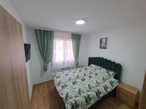 Giường trong phòng chung tại Apartman Vranic Zlatibor