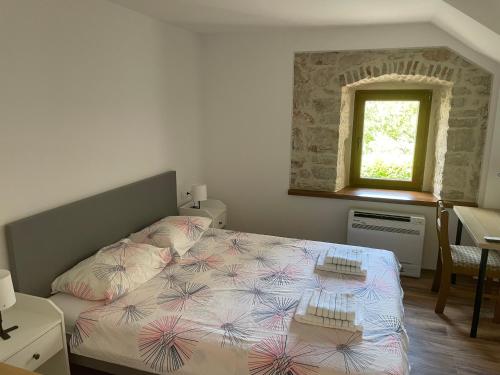 Postel nebo postele na pokoji v ubytování Apartment Makjanić