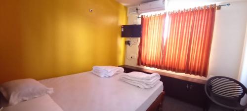 Posteľ alebo postele v izbe v ubytovaní Shiva Deluxe Lodge
