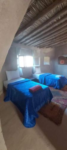 ecolodge bivouac des aiglesにあるベッド