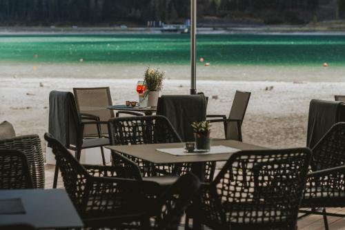 a group of tables and chairs on the beach at Familienresort Buchau in Maurach