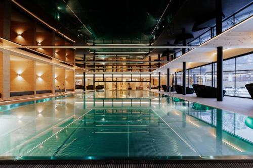 a swimming pool in a building at Familienresort Buchau in Maurach