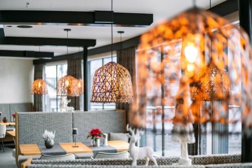 a restaurant with a table with a deer in the foreground at Familienresort Buchau in Maurach