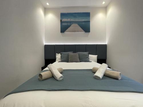 a bedroom with a large bed with pillows on it at Sarrikobaso House in Getxo