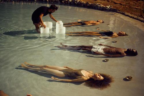 a group of people laying in the water at Cayo Levantado Resort - All Inclusive in Santa Bárbara de Samaná
