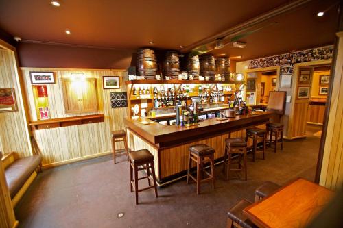 a bar in a restaurant with a lot of chairs at St Ola Hotel in Kirkwall