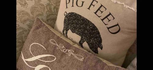 a person with a tattoo of a pig on their stomach at Piglet Lodge in Pebworth