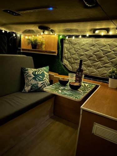 a bottle of wine on a table in a rv at The Blue Whale in Los Abrigos