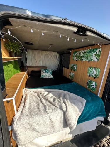 a bed in the back of a van at The Blue Whale in Los Abrigos