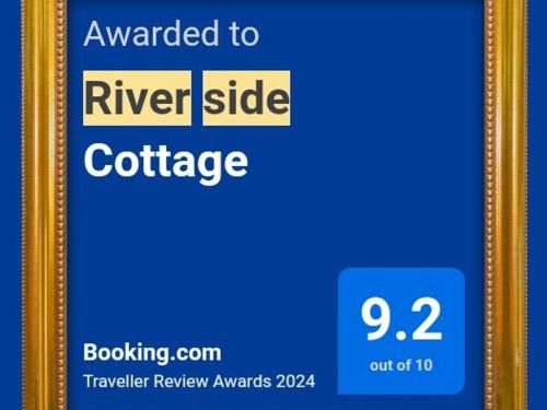 Сертификат, награда, вывеска или другой документ, выставленный в River Side Cottage