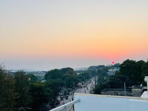 a view of a city street at sunset at Hotel Sangam View in Prayagraj