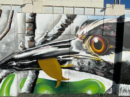 a painting of a fish on the side of a building at Boricua Guest House Apartment in Yauco