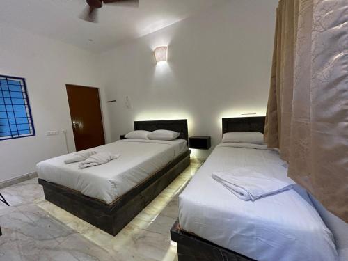 Postel nebo postele na pokoji v ubytování La Tamara Auroville