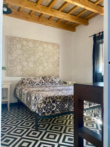 a bedroom with a bed and a table in it at Ilusiones del Mar in El Palmar