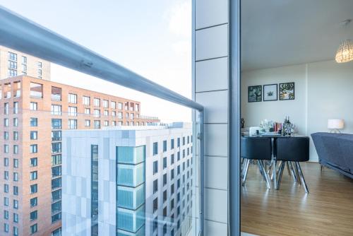 a room with a view of a tall building at Brightleap Apartments - The Hub in Milton Keynes