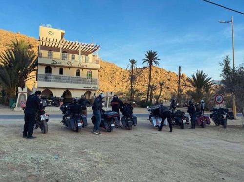 a group of motorcycles parked in front of a building at Dar izem in Tafraoute