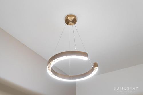 a circular light hanging from a ceiling at Boho Inspired Large Luxury Villa in Dubai
