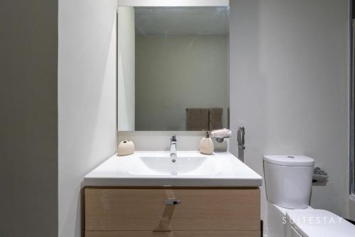 a bathroom with a white sink and a mirror at Boho Inspired Large Luxury Villa in Dubai