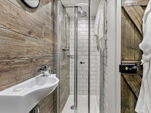 a bathroom with a sink and a shower at 1 bed property in St Ives 85786 in St Ives