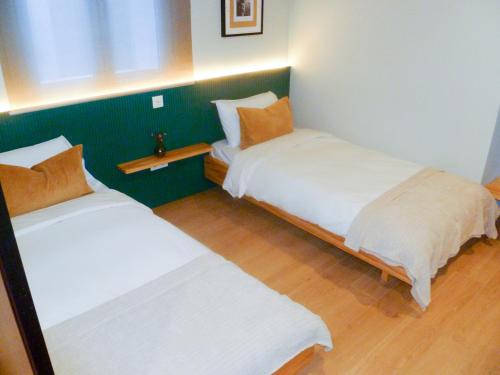 Postel nebo postele na pokoji v ubytování OLBLANC Plaza de España by Batuecas