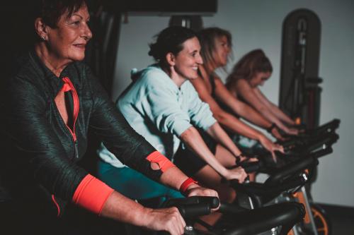 a group of people riding bikes in a gym at Les Terrasses du Port in Saint-Pierre
