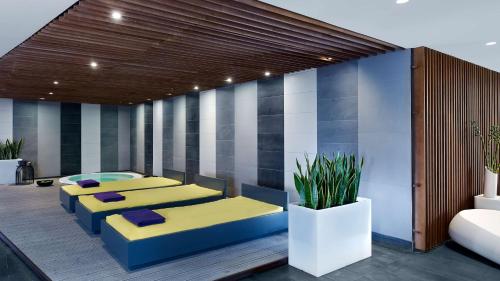 a room with four beds in a room at Park Plaza Belvedere Medulin in Medulin