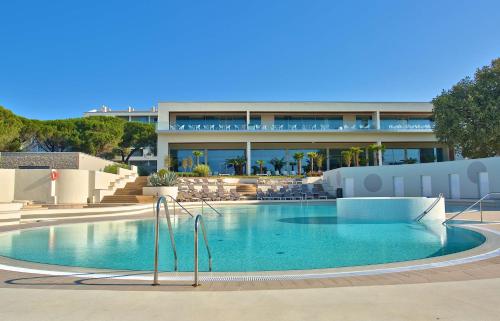 a large swimming pool in front of a building at Park Plaza Belvedere Medulin in Medulin