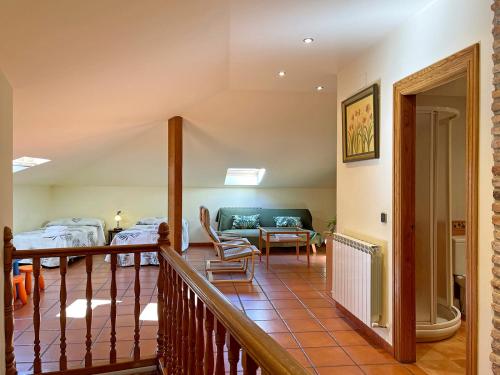 a room with a balcony with a living room at Casar Rural Lazkua I-II in Eraul