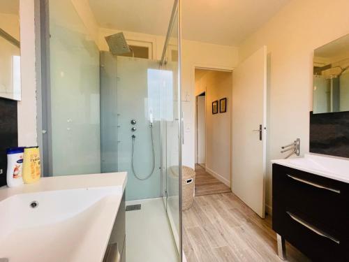 a bathroom with a shower and a sink at Beach House 50 in Omonville-la-Rogue