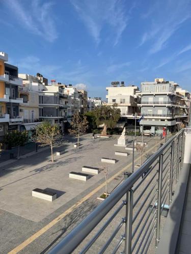 a view of a parking lot with some buildings at Central Square apartment by the sea in Ierápetra