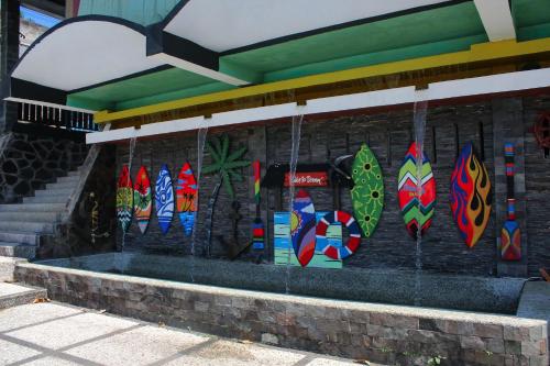 a building with colorful kites on the side of it at Nirwana Lembang in Tangkubanperahu