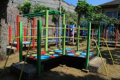 a park with a playground with a play structure at Nirwana Lembang in Tangkubanperahu