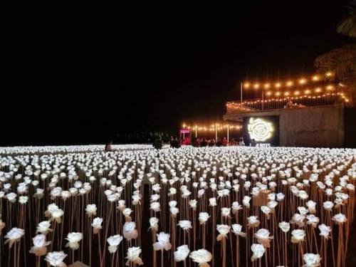 a large group of umbrellas in front of a clock at Mactan Newtown Beach Condo in Mactan