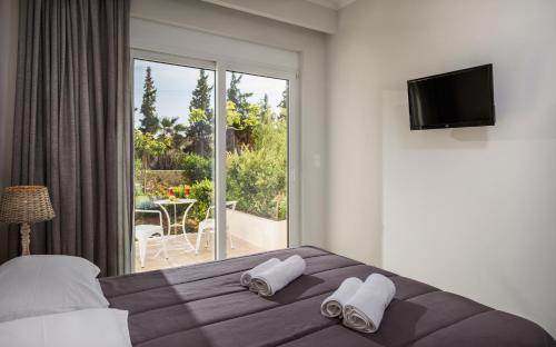 Ένα ή περισσότερα κρεβάτια σε δωμάτιο στο Mear Luxury Holiday Homes - Cretan Sunny Gems