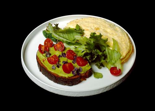 a plate of food with a sandwich and a salad at WHITE HILLS HOTEL spa&sport in Uzhhorod