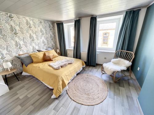 Ένα ή περισσότερα κρεβάτια σε δωμάτιο στο Le Doux Refuge de Bouillon