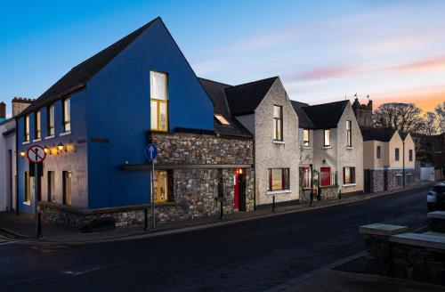 a blue building on the side of a street at The Oystercatcher Lodge Guest House in Carlingford