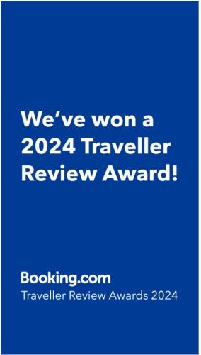 a blue sign that says weve won a traveler review award at Affordable Condo in Makati w/ Wi-Fi, Netflix, Pool in Manila