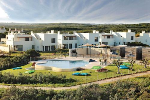 an aerial view of a villa with a swimming pool at Martinhal Sagres Beach Family Resort Hotel in Sagres