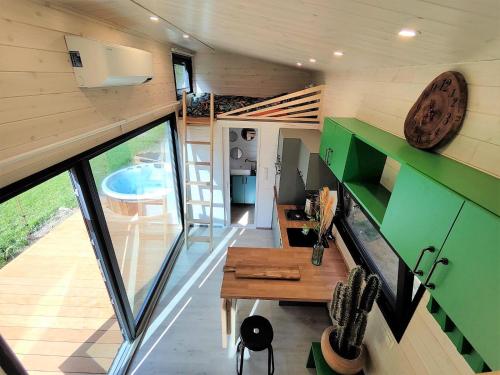 a view of a living room of a tiny house at La mini maison du Lama in Libin