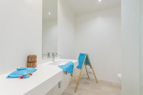 a bathroom with a sink and a mirror at Ran de Mar - First Line Studio in Alcudia