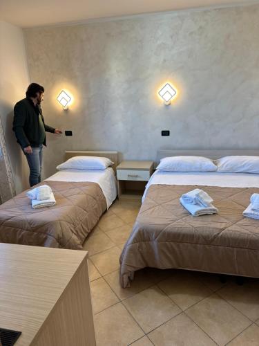 Ein Bett oder Betten in einem Zimmer der Unterkunft Scilla e Cariddi