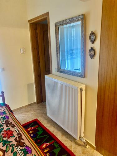 a room with a radiator and a window at Lake Stories in Koutsodímos